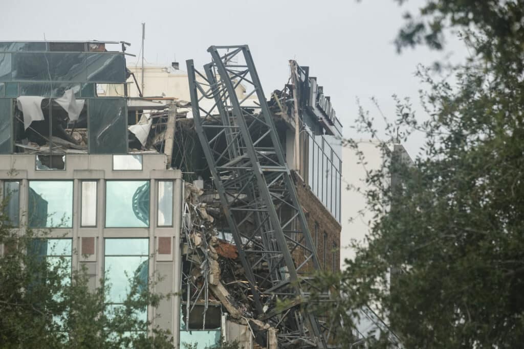 A crane collapsed into a building in downtown St. Petersburg due to Hurricane Milton on October 10, 2024 in Florida. | Photo by Bryan R. SMITH / AFP