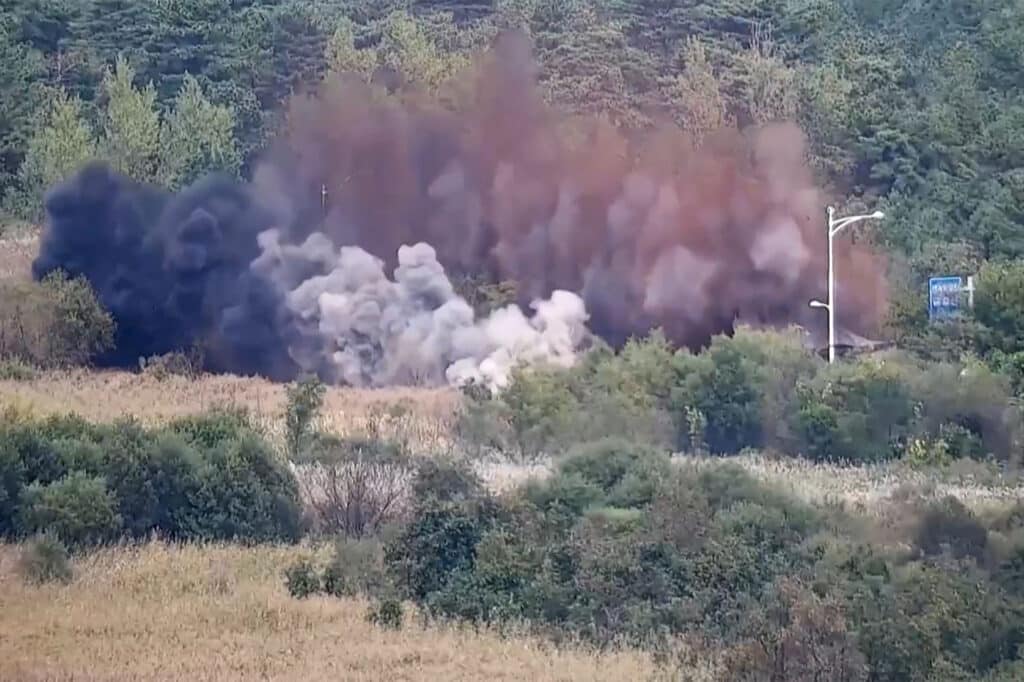 North Korea blows up roads, rails to South. This screen grab taken from video released by the South Korean Defence Ministry and filmed from an undisclosed location in South Korea along the inter-Korean border shows an explosion on a road connecting North and South Korea on October 15, 2024. | Photo by Handout / South Korea Defense Ministry / AFP