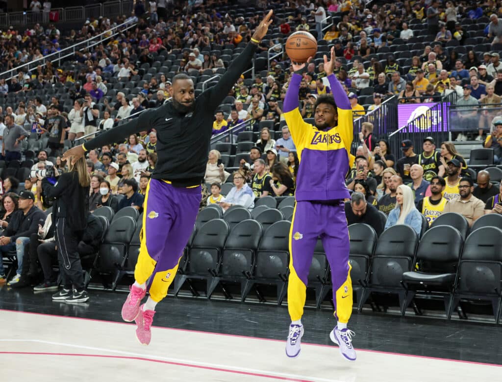 LeBron James (left) #23 and Bronny James #9 of the Los Angeles Lakers warm up before a preseason game against the Golden State Warriors at T-Mobile Arena at T-Mobile Arena on October 15, 2024 in Las Vegas, Nevada. |  Ethan Miller/Getty Images/AFP