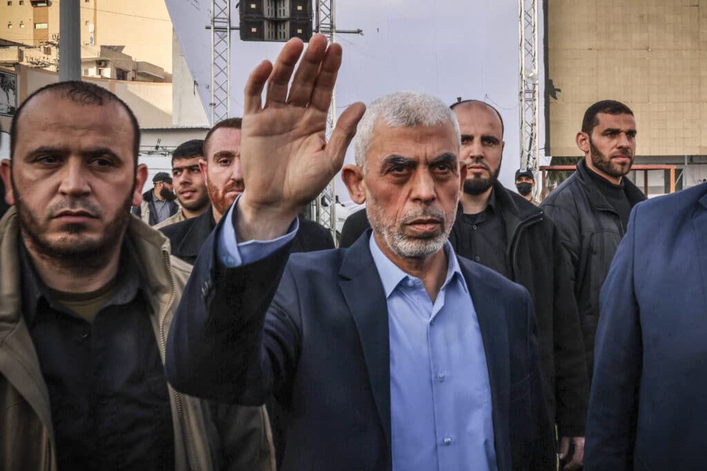 Israel military: Hamas leader Sinwar killed in firefight in Gaza. (FILES) Photo shows Yahya al-Sinwar (center), Gaza Strip chief of the Palestinian Islamist Hamas movement, waving to supporters as he arrives to attend a rally marking Al-Quds (Jerusalem) Day, a commemoration in support of the Palestinian people celebrated annually on the last Friday of the Muslim fasting month of Ramadan, in Gaza City, on April 14, 2023.  | Photo by MOHAMMED ABED / AFP