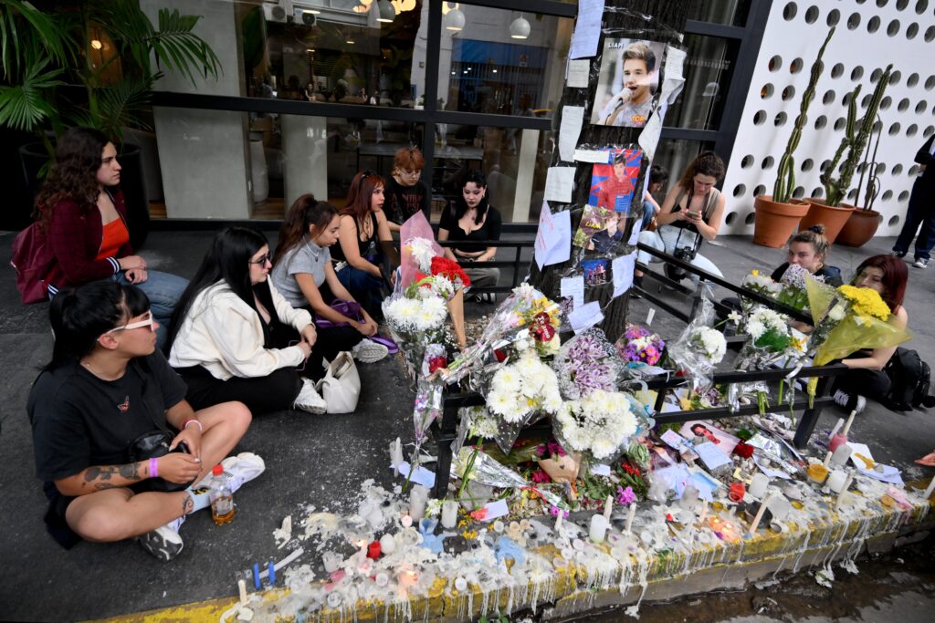 Liam's death: Former One Direction members 'completely devastated'. Fans pay tribute to British singer Liam Payne in front of the hotel where he died in Buenos Aires on October 17, 2024. | Photo by Luis ROBAYO / AFP