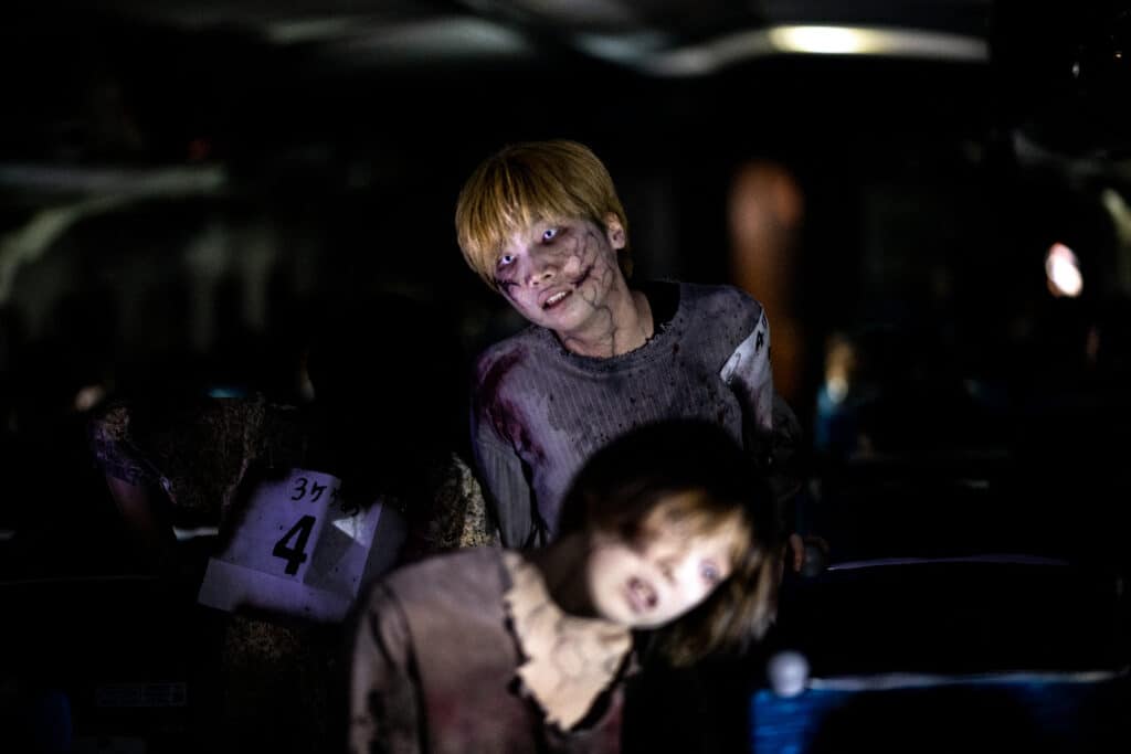 Actors perform for passengers during the 'Zombie Shinkansen' event on a bullet train from Tokyo to Osaka, ahead of Halloween on October 19, 2024. (Photo by Philip FONG / AFP)