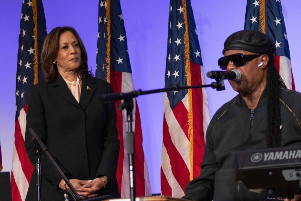 US musician Stevie Wonder (R) performs during a campaign event with US Vice President and Democratic presidential candidate Kamala Harris at Divine Faith Ministries International in Jonesboro, Georgia, October 20, 2024. (Photo by CHRISTIAN MONTERROSA / AFP)