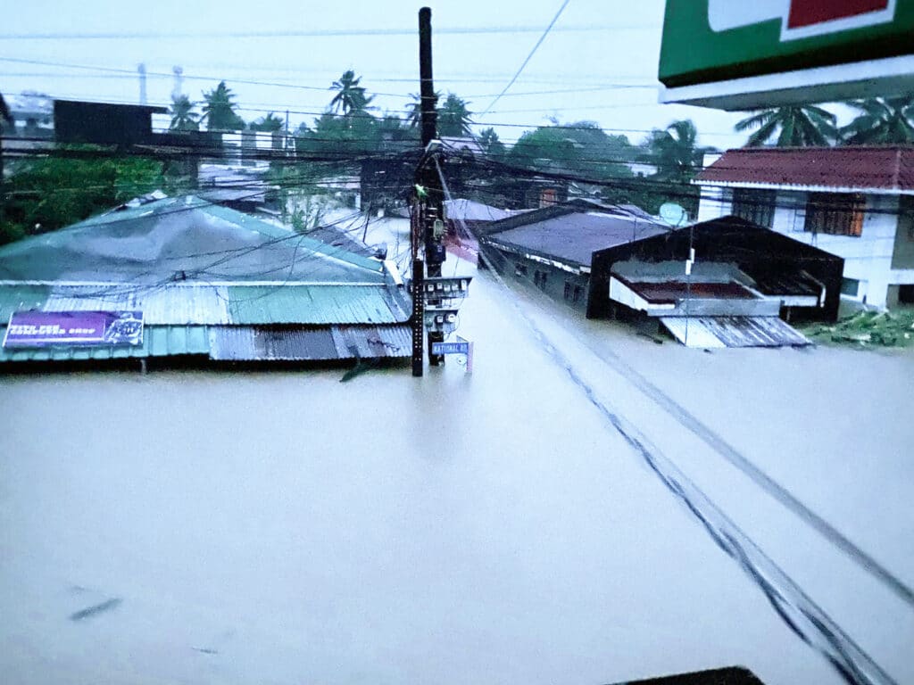 A handout photo from the facebook page of Ree Tabagan taken on October 23, 2024, shows flooded roads due to tropical storm Trami in Bato, Camarines Sur. | Photo by Ree Tabagan / facebook page of Ree Tabagan / AFP