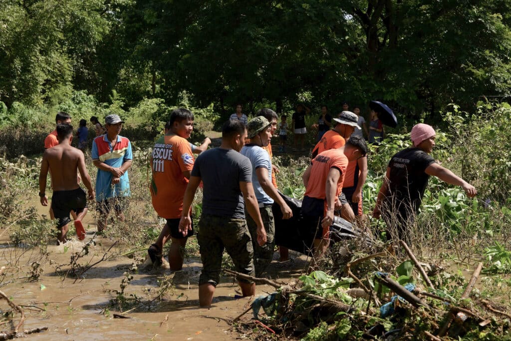 Kristine death toll rises to 110, says Office of Civil Defense. Rescuers and volunteers carry a body bag containing a dead villager found at a flooded area of a village in Tuguegarao, Cagayan province, north of Manila on October 26, 2024.| Photo by JOHN DIMAIN / AFP