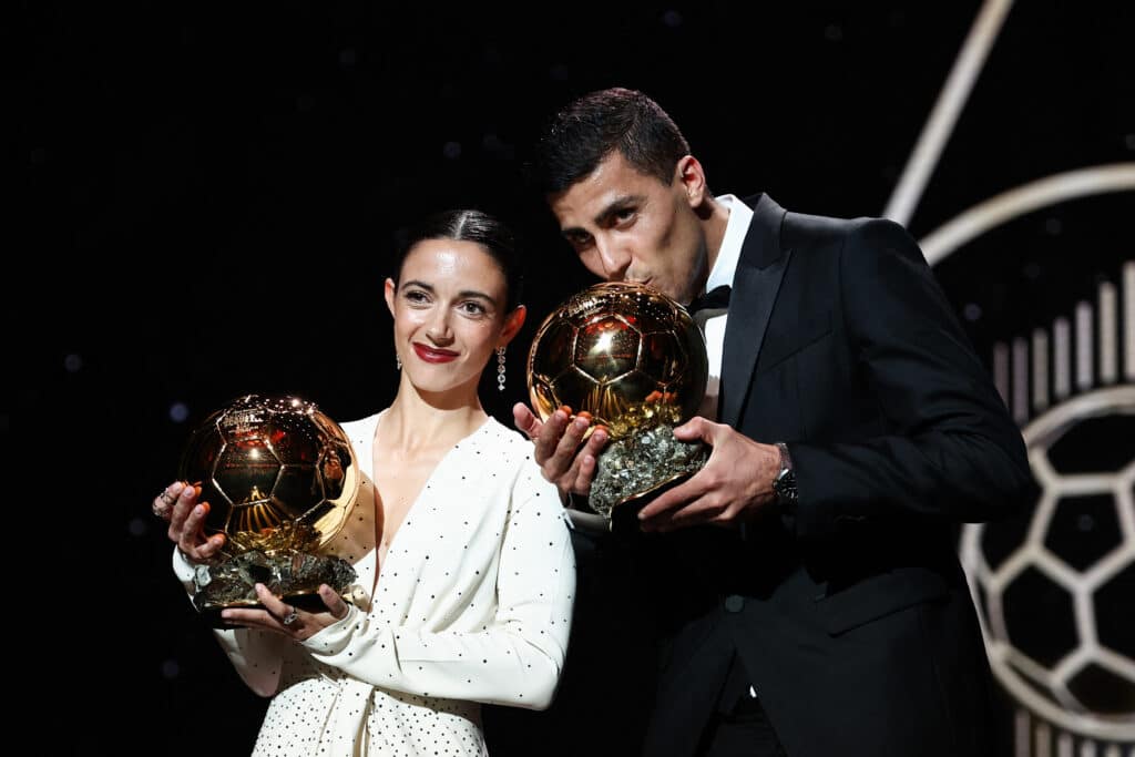 Barcelona's Spansih midfielder Aitana Bonmati (L) and Manchester City's Spanish midfielder Rodri pose with their Ballon d'Or award during the 2024 Ballon d'Or France Football award ceremony at the Theatre du Chatelet in Paris on October 28, 2024. (Photo by FRANCK FIFE / AFP)