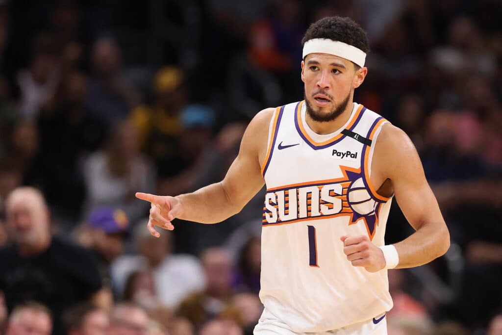 NBA: Booker scores 30, Durant 33 as Suns give Lakers its 1st loss, Devin Booker #1 of the Phoenix Suns reacts after scoring against the Los Angeles Lakers during the second half of the NBA game at Footprint Center on October 28, 2024 in Phoenix, Arizona. The Suns defeated the Lakers 109-105. | Photo by Christian Petersen | Getty Images via AFP