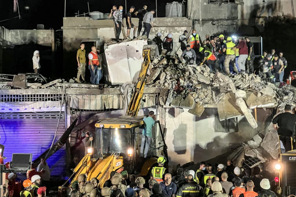 Civil defence rescuers search for survivors at the site of an Israeli air strike on the village of Haret Saida, near Lebanon's southern city of Sidon, on October 29, 2024. | Photo by Mahmoud ZAYYAT / AFP