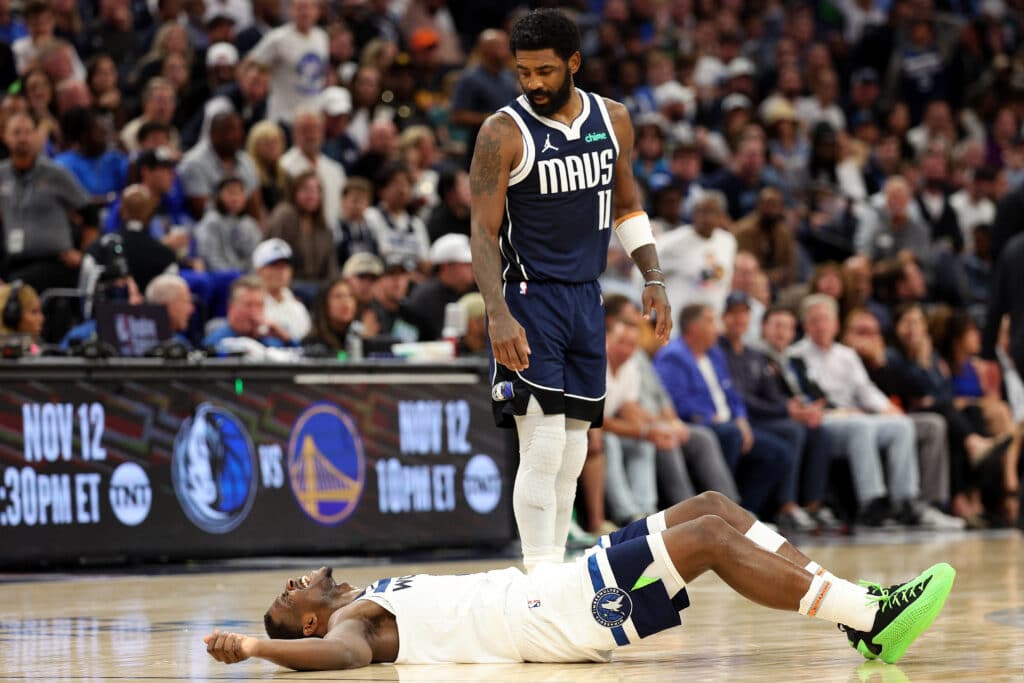 NBA: Mavericks down Timberwolves as Irving outduels Edwards. In photo is Kyrie Irving #11 of the Dallas Mavericks reacting to an injured Anthony Edwards #5 of the Minnesota Timberwolves in the third quarter. Edwards remained in the game at Target Center on October 29, 2024 in Minneapolis, Minnesota. The Mavericks defeated the Timberwolves 120-114.| Photo by David Berding / Getty Images via AFP