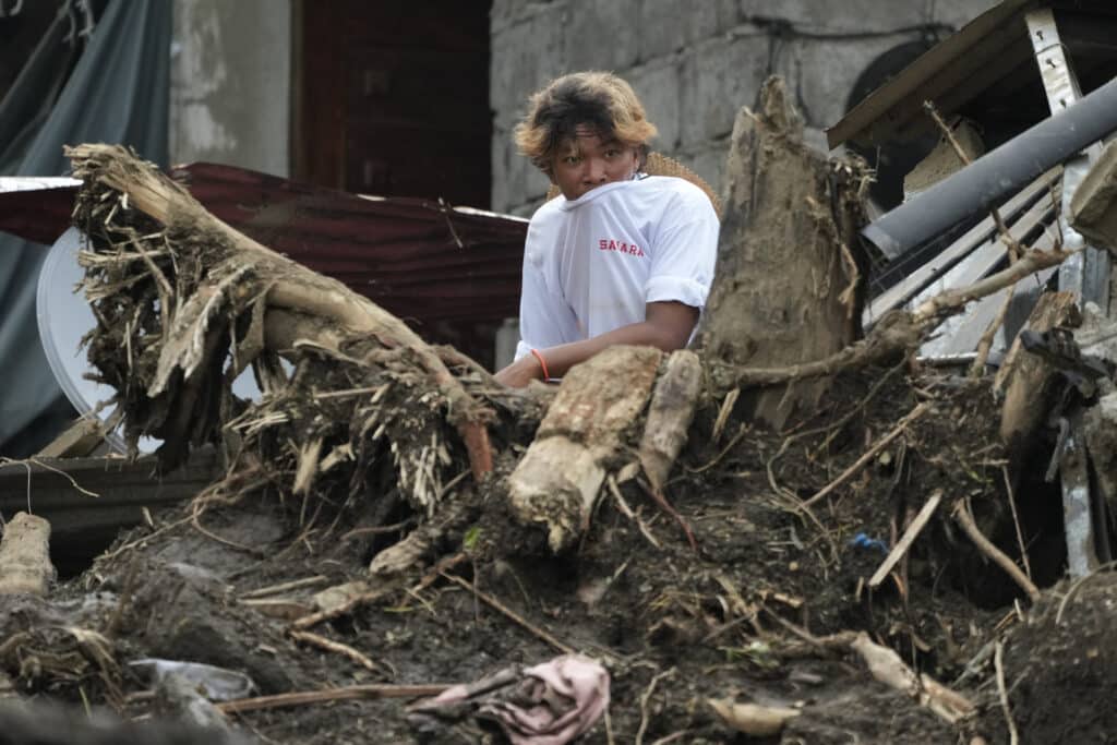 A villager watches rescue operations after a recent landslide triggered by Severe Tropical Storm Kristine (international name: Trami) struck Talisay, Batangas province, Philippines leaving thousands homeless and several villagers dead on Saturday, Oct. 26, 2024. |AP Photo/Aaron Favila