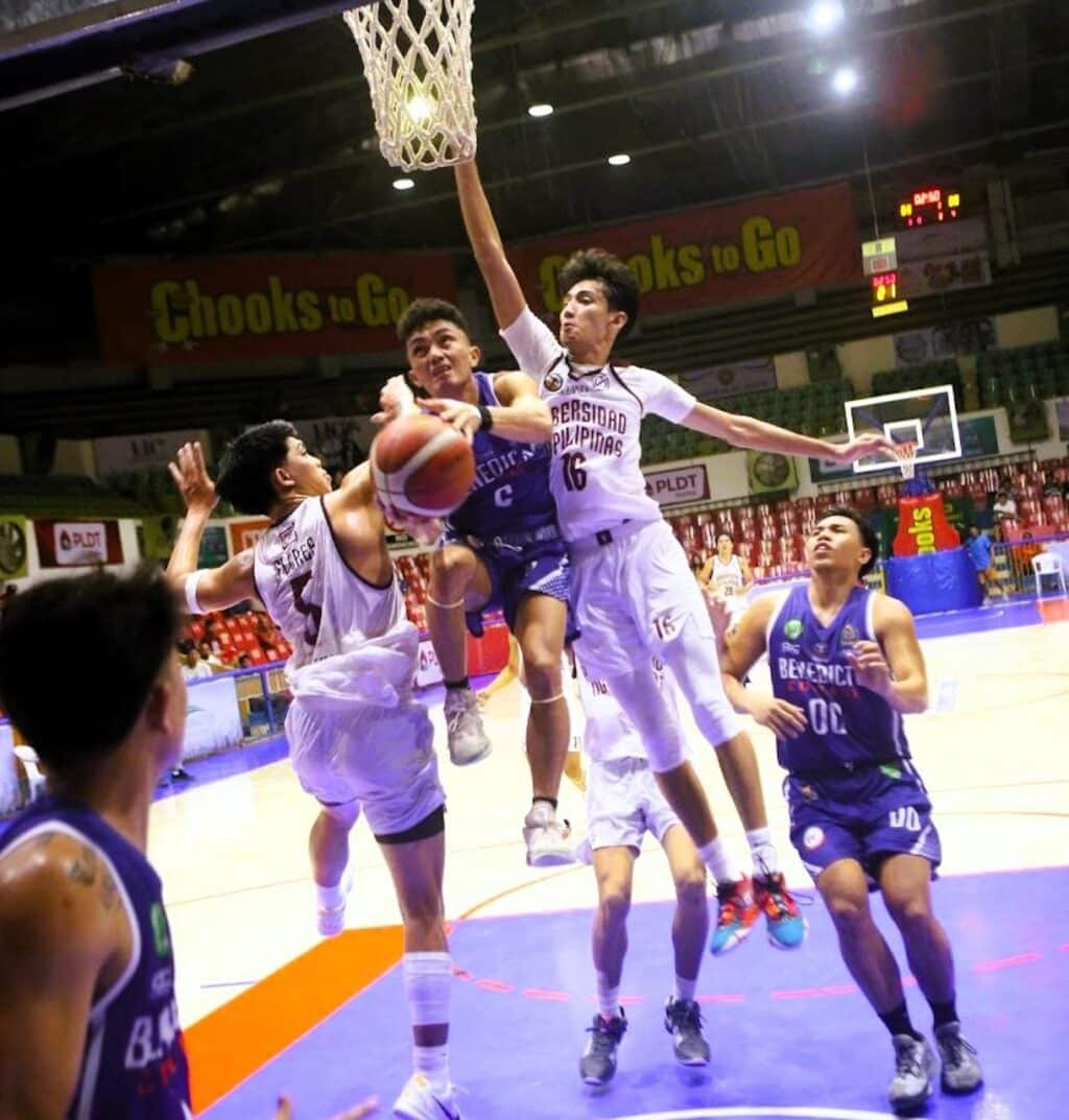 Benedicto College's Rogelio Tolipas Jr. goes for a tough shot during their Cesafi Season 24 game against UP Cebu. | Photo from Sugbuanong Kodaker