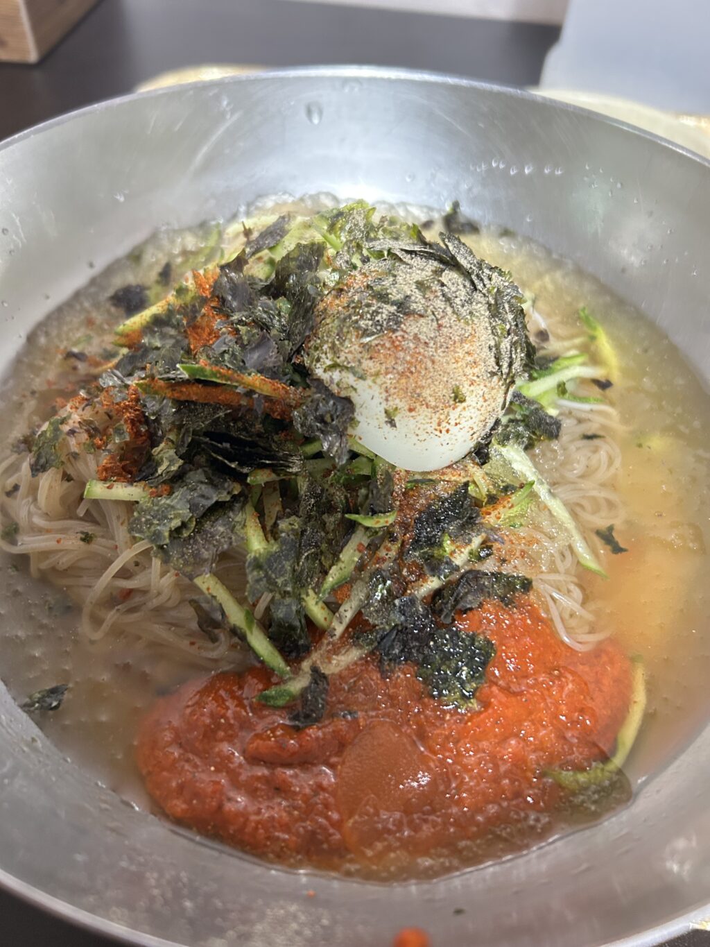 Bibim-naengmyeon, a variant of North Korea's naengmyeon noodles, sold in a local restaurant in Gyodong Island. Naengmyeon noodles are made from buckwheat instead of wheat, and usually mixed with either potatoes or sweet potatoes. They are known for being chewy and thin. | Photo by Morexette Marie Erram