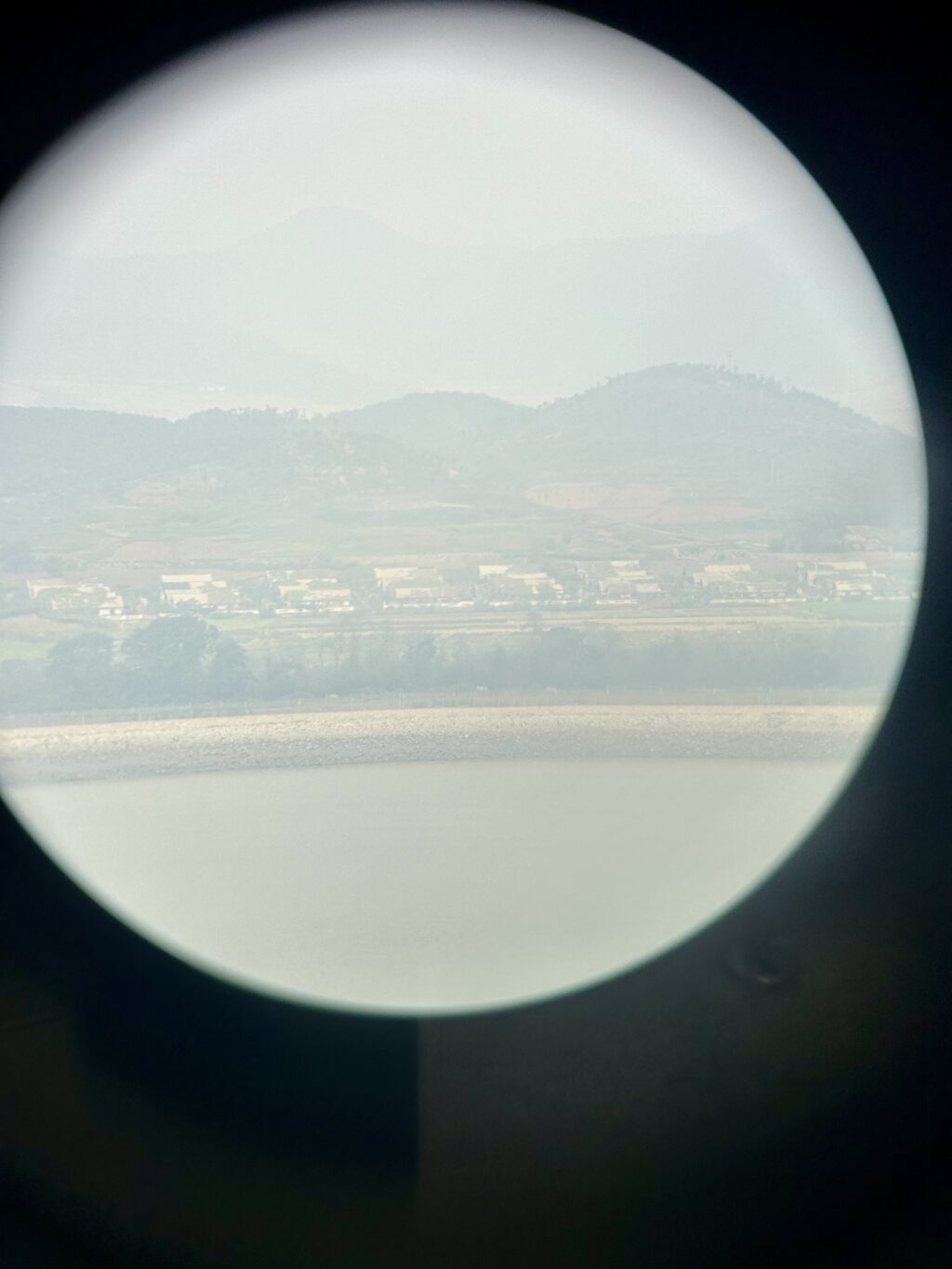 A peek into North Korea: Housing complex and apartments in a coastal village in North Korea can be seen through the binoculars at the Ganghwa Peace Observatory in Ganghwa Island, Incheon, South Korea. | Photo by Morexette Marie Erram