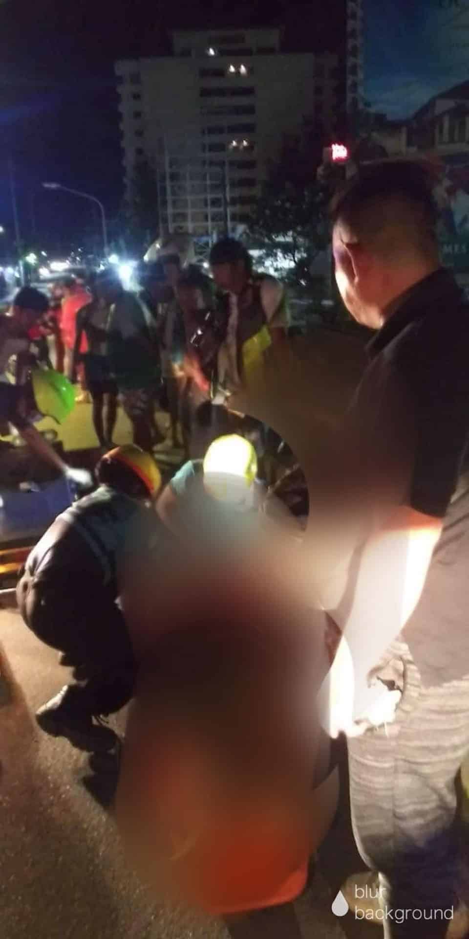 Emergency responders secure a woman on a stretcher as they prepare to rush her to the hospital, the accident victim however, did not make it alive. | Paul Lauro