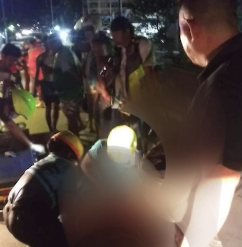 Emergency responders secure a woman on a stretcher as they prepare to rush her to the hospital, the accident victim however, did not make it alive. | Paul Lauro