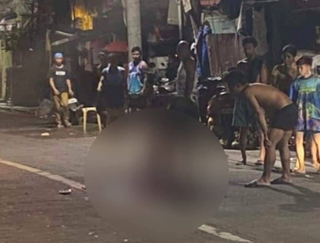 Residents of Brgy. Day-as in Cebu City rush out of their homes after learning of a shooting incident involving a man who was sitting by the side of the road at past 4:00 a.m. on Wednesday, October 30. | Paul Lauro