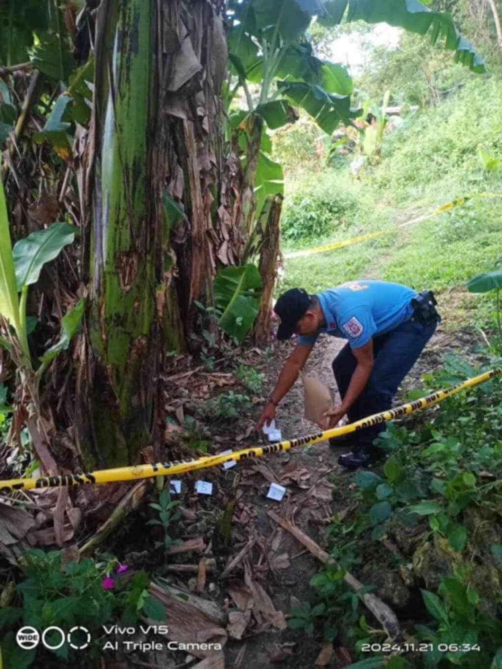 ‘Barang’ reason for attack on elderly couple in Borbon, Cebu? A member of the Scene of the Crime Operative of the police is processing the crime scene where an elderly woman was shot and killed while her husband was wounded. | Contributed photo via Paul Lauro