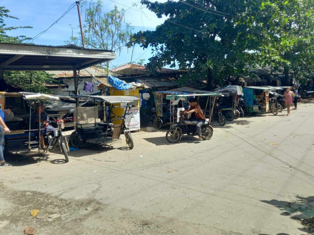 E-bike ban in Mandaue: Mayor Bercede to tackle this with TEAM . E-bikes lined at the corner of 6.5 relocation site in Barangay Paknaan waiting for passengers. | CDN Digital Photo by Mary Rose Sagarino