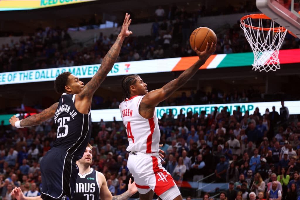 P.J. Washington #25 of the Dallas Mavericks tried to defend against a shot by Jalen Green #4 of the Houston Rockets in the second half of a basketball game at American Airlines Center on October 31, 2024 in Dallas, Texas. | Photo by Richard Rodriguez / Getty Images via AFP