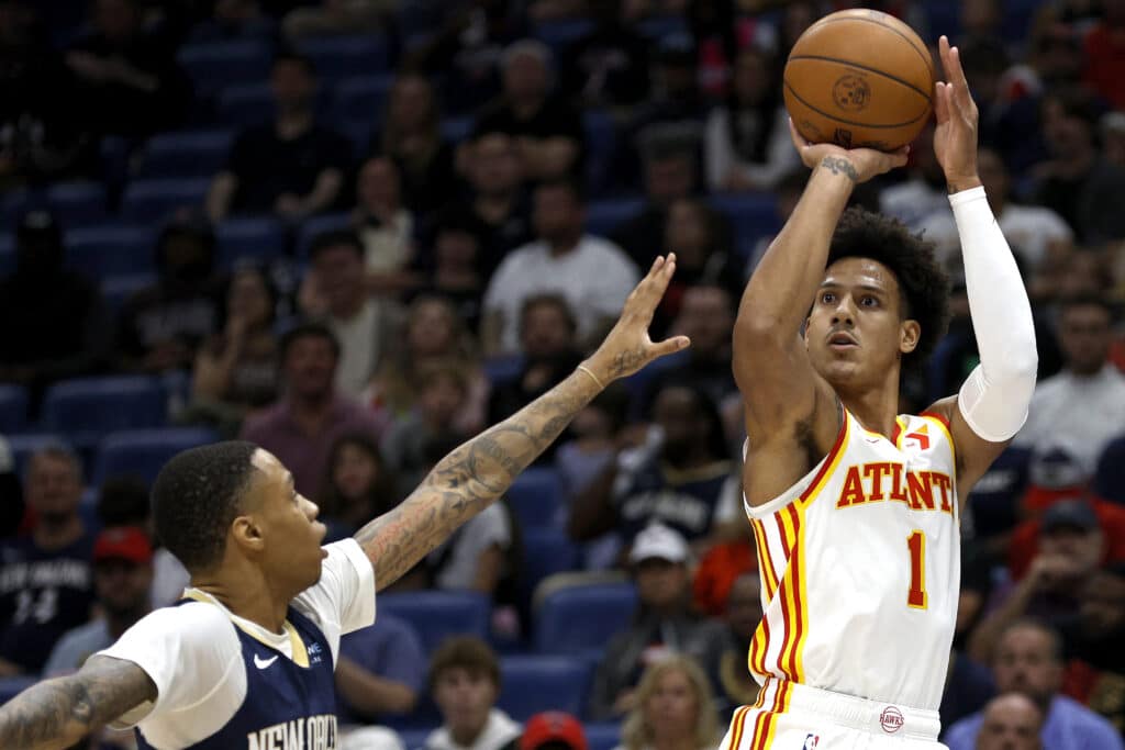 Jalen Johnson #1 of the Atlanta Hawks shoots a three-point basket over Jordan Hawkins #24 of the New Orleans Pelicans during the first quarter at Smoothie King Center on November 03, 2024 in New Orleans, Louisiana. | Photo by Sean Gardner/ Getty Images via AFP