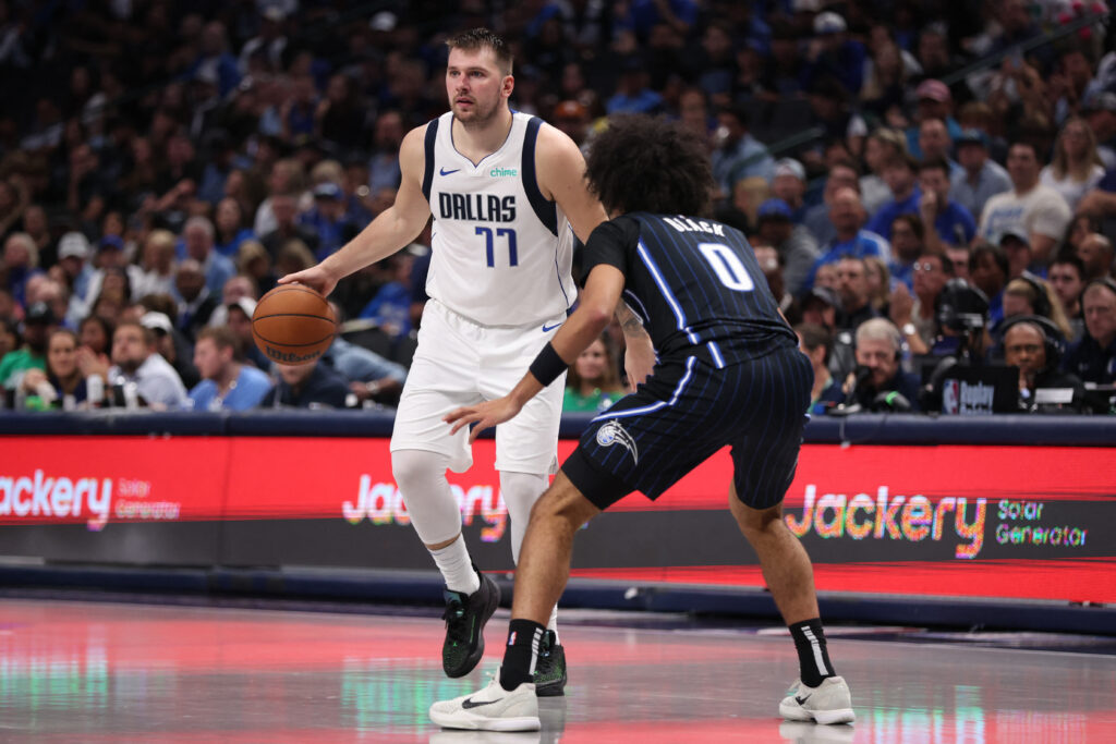 Luka Doncic #77 of the Dallas Mavericks is defended by Anthony Black #0 of the Orlando Magic during the second half at American Airlines Center on November 03, 2024 in Dallas, Texas.| Photo by Sam Hodde/Getty Images/AFP