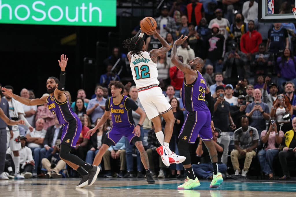 Ja Morant #12 of the Memphis Grizzlies shoots against LeBron James #23 of the Los Angeles Lakers during the first half at FedExForum on November 06, 2024 in Memphis, Tennessee.| Justin Ford/Getty Images/AFP