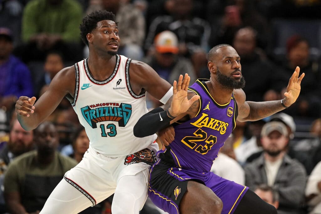 LeBron James #23 of the Los Angeles Lakers guards Jaren Jackson Jr. #13 of the Memphis Grizzlies in the first half at FedExForum on November 06, 2024 in Memphis, Tennessee.| Justin Ford/Getty Images/AFP