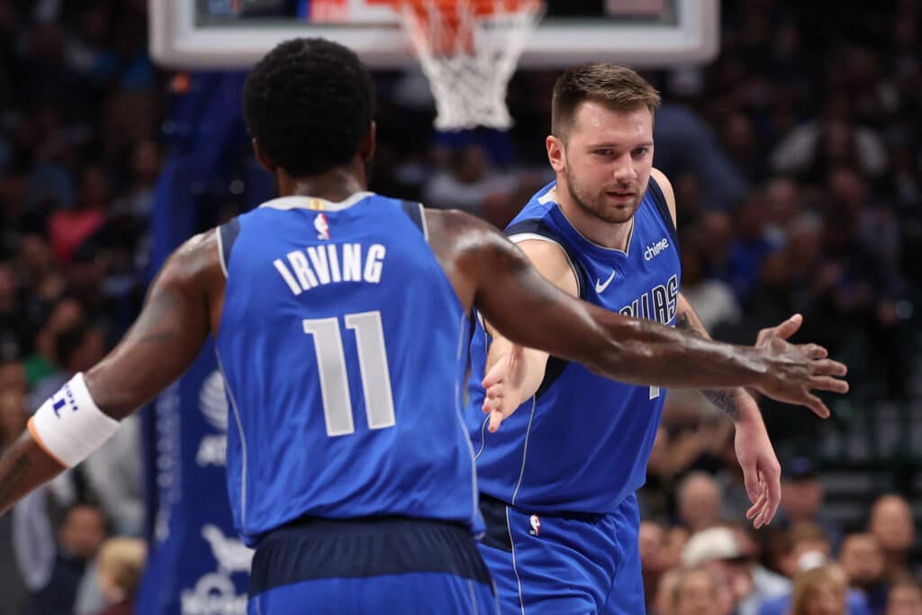 NBA: Mavericks tame Bulls as Doncic scores 27,  Irving 17. Luka Doncic #77 and Kyrie Irving #11 of the Dallas Mavericks celebrate after a score during the first half against the Chicago Bulls at American Airlines Center on November 06, 2024 in Dallas, Texas. | Sam Hodde/Getty Images/AFP