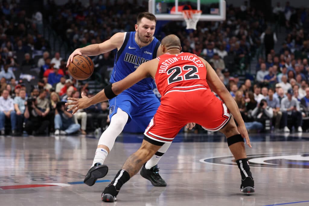 Luka Doncic #77 of the Dallas Mavericks is defended by Talen Horton-Tucker #22 of the Chicago Bulls during the first half at American Airlines Center on November 06, 2024 in Dallas, Texas. | Sam Hodde/Getty Images/AFP