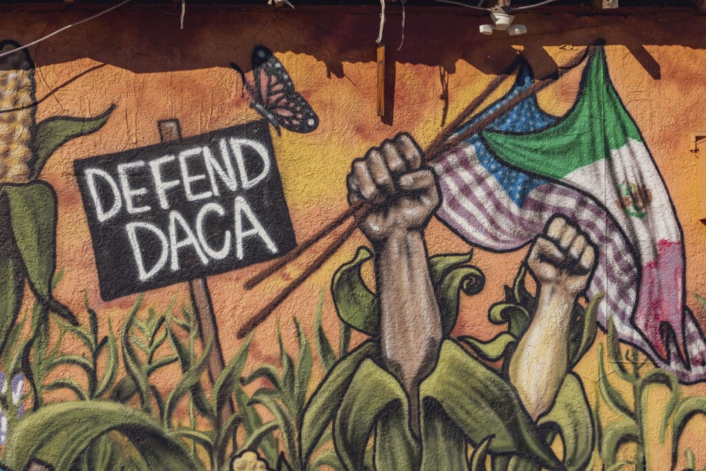 Trump returns: Undocumented immigrants in US ‘terrified’. A mural reads "Defend DACA" (Deferred Action for Childhood Arrivals) in south Phoenix, Arizona, on November 6, 2024. | Photo by Olivier Touron / AFP