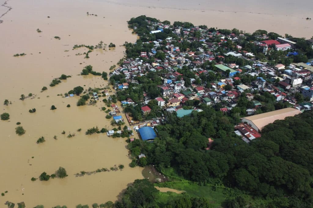 An aerial view shows submerged homes at a village in Ilagan, Isabela province on November 18, 2024, due to continuous heavy rains from Super Typhoon Pepito. | Photo by Villamor VISAYA / AFP