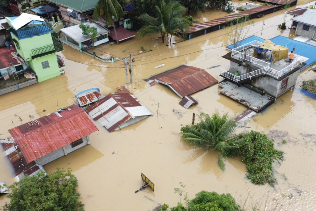 An aerial view shows submerged homes at a village in Ilagan, Isabela province on November 18, 2024, due to continuous heavy rains from Super Typhoon Man-yi. | Photo by Villamor VISAYA / AFP