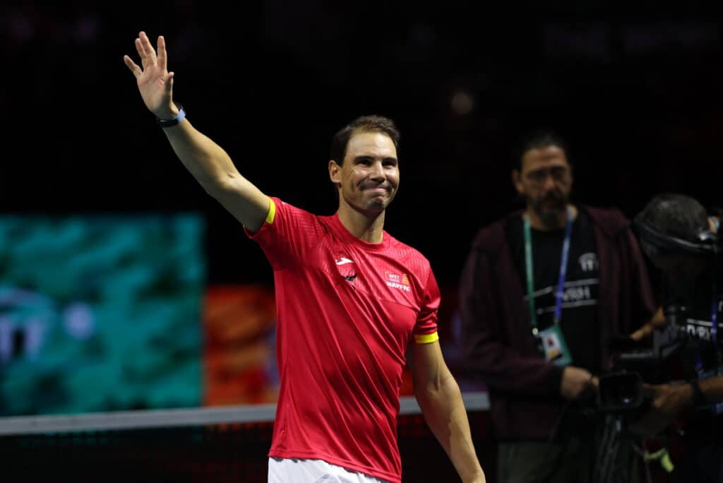 Rafael Nadal waves to during a tribute to him at the end of the at the end of the quarter-final doubles match between Netherlands and Spain during the Davis Cup Finals at the Palacio de Deportes Jose Maria Martin Carpena arena in Malaga, southern Spain, on November 19, 2024. | Photo by Thomas COEX / AFP