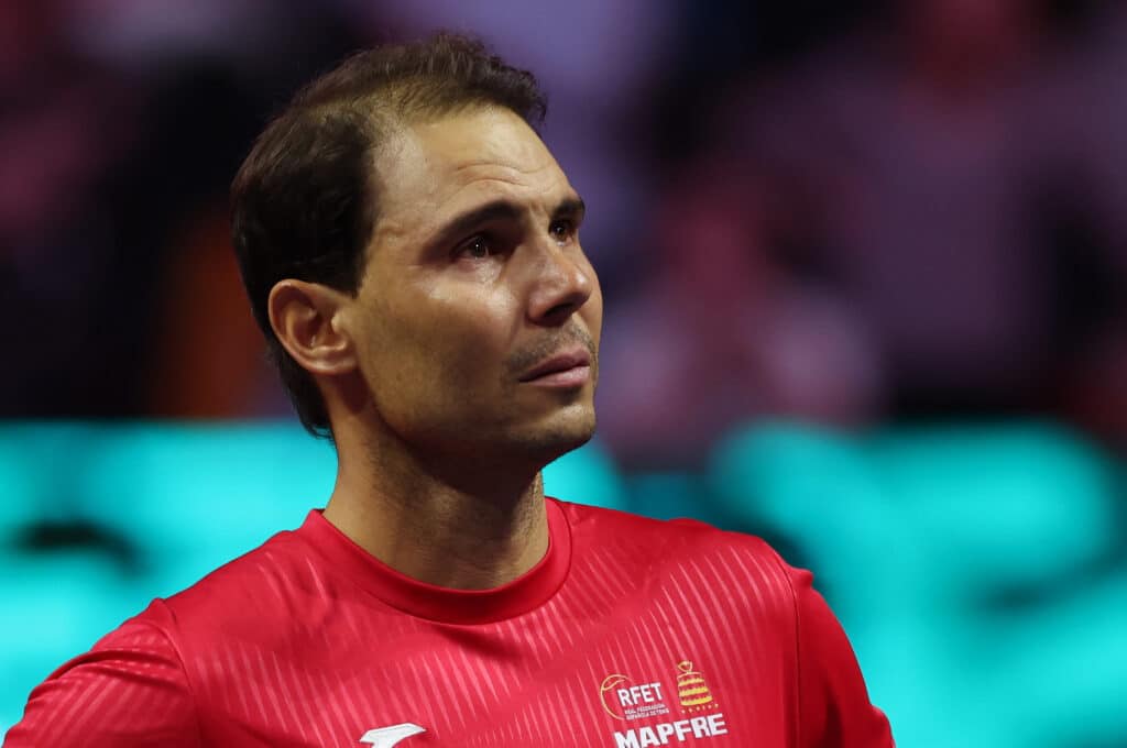 Spain's Rafael Nadal cries as he attends a tribute to his career at the end of the quarter-final doubles match between Netherlands and Spain during the Davis Cup Finals at the Palacio de Deportes Jose Maria Martin Carpena arena in Malaga, southern Spain, on November 19, 2024. | Photo by Thomas COEX / AFP