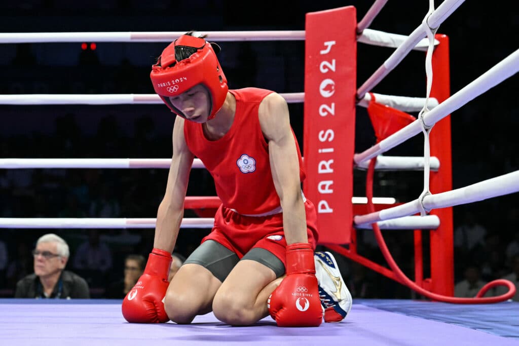 (FILES) Taiwan's Lin Yu-ting reacts after slipping duing the women's 57kg quarter-final boxing match against Bulgaria's Svetlana Kamenova Staneva during the Paris 2024 Olympic Games at the North Paris Arena, in Villepinte on August 4, 2024. | Photo by MOHD RASFAN / AFP