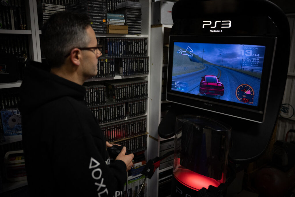 PlayStation: Fun facts to know as Sony's console turns 30. In photo is a French PlayStation' collector Cyril, playing to PlayStation 3, at his home in Vraiville, on November 20, 2024. | Photo by LOU BENOIST / AFP