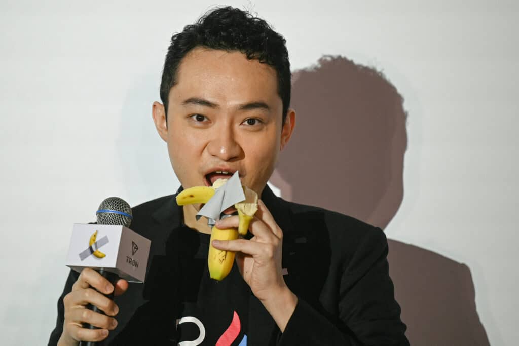 Crypto boss eats banana art he bought for $6.2 million. Chinese-born crypto founder Justin Sun eats a banana artwork composed of a fresh banana stuck to a wall with duct tape, in Hong Kong on November 29, 2024, after buying the provocative work of conceptual art by Italian artist Maurizio Cattelan at a New York auction for $6.2 million. | Photo by Peter PARKS / AFP