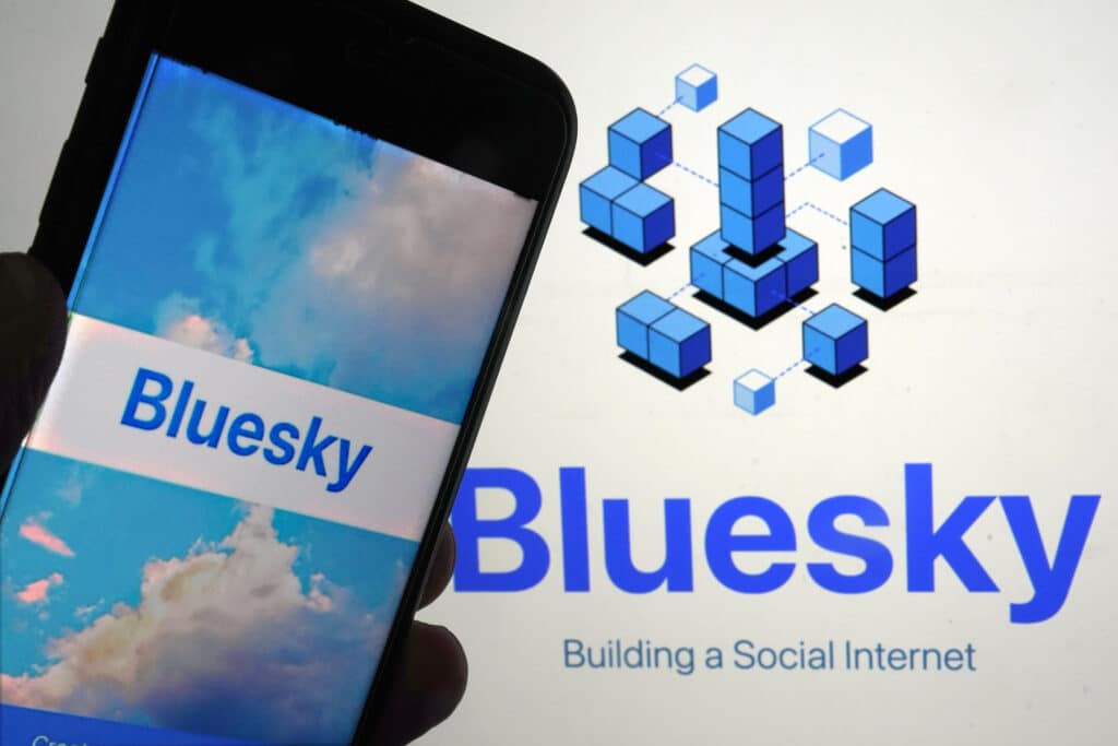 Bluesky, an alternative to X, adds 1M users since US elections.  The app for Bluesky is shown on a mobile phone, left, and on a laptop screen on June 2, 2023, in New York. (AP Photo/Richard Drew, File)