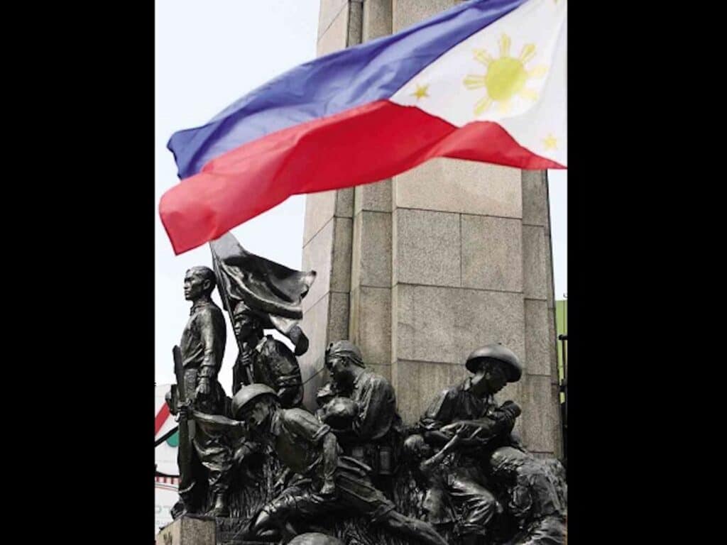 The Philippine flag flutters in the wind at the monument of Andres Bonifacio in Caloocan City as the nation celebrates the birth anniversary of the Father of the Philippine Revolution on Nov. 30, in this file photo taken in 2013. INQUIRER file photo / MARIANNE BERMUDEZ