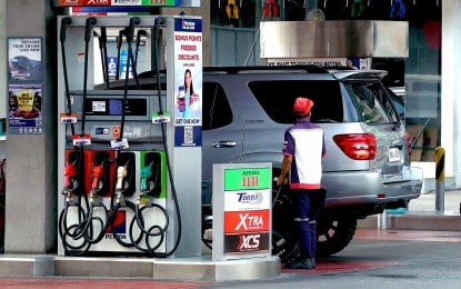 Fuel price hikes: Diesel up by P2.10/L, gasoline by P1.50/L. A motorist refuels at a gas station in South Triangle, Quezon City in this undated photo. | PNA photo by Ben Briones