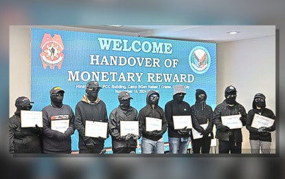 CRIME BUSTERS, TOO. Nine tipsters of the Philippine National Police (PNP) receive rewards in simple rites in Camp Crame, Quezon City on Nov. 15, 2024. The PNP said Thursday (Nov. 21) that the information will split the PHP1.8 million reward for providing vital information that led to the capture of nine wanted persons. (Photo courtesy of PNP)