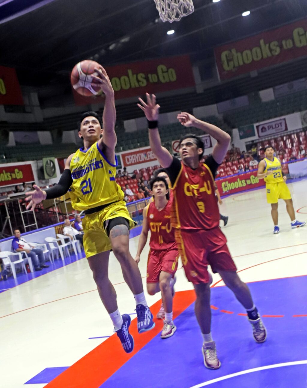 Danie Boy Lapiz of UC drives past CIT-U's Josiah Villamayor during their Cesafi Season 24 game