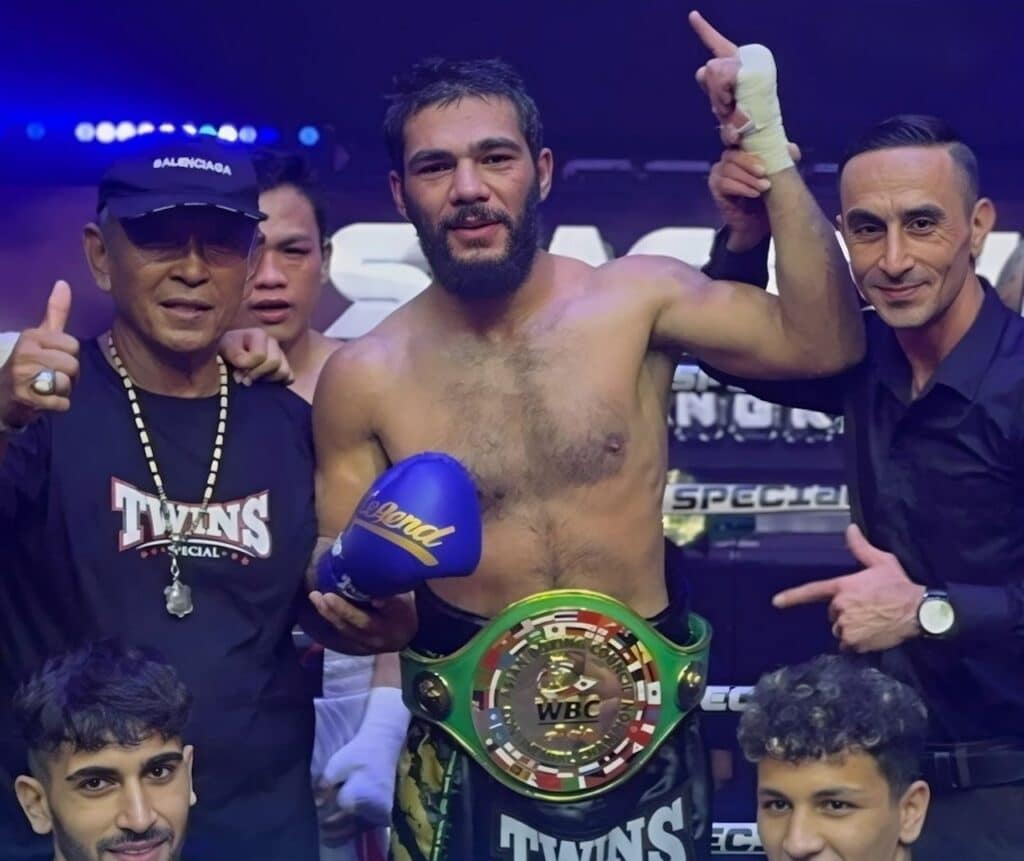 Mahdi Sarbaz raising his hand in celebration after beating Jimmy Paypa in Thailand. | Instagram photo