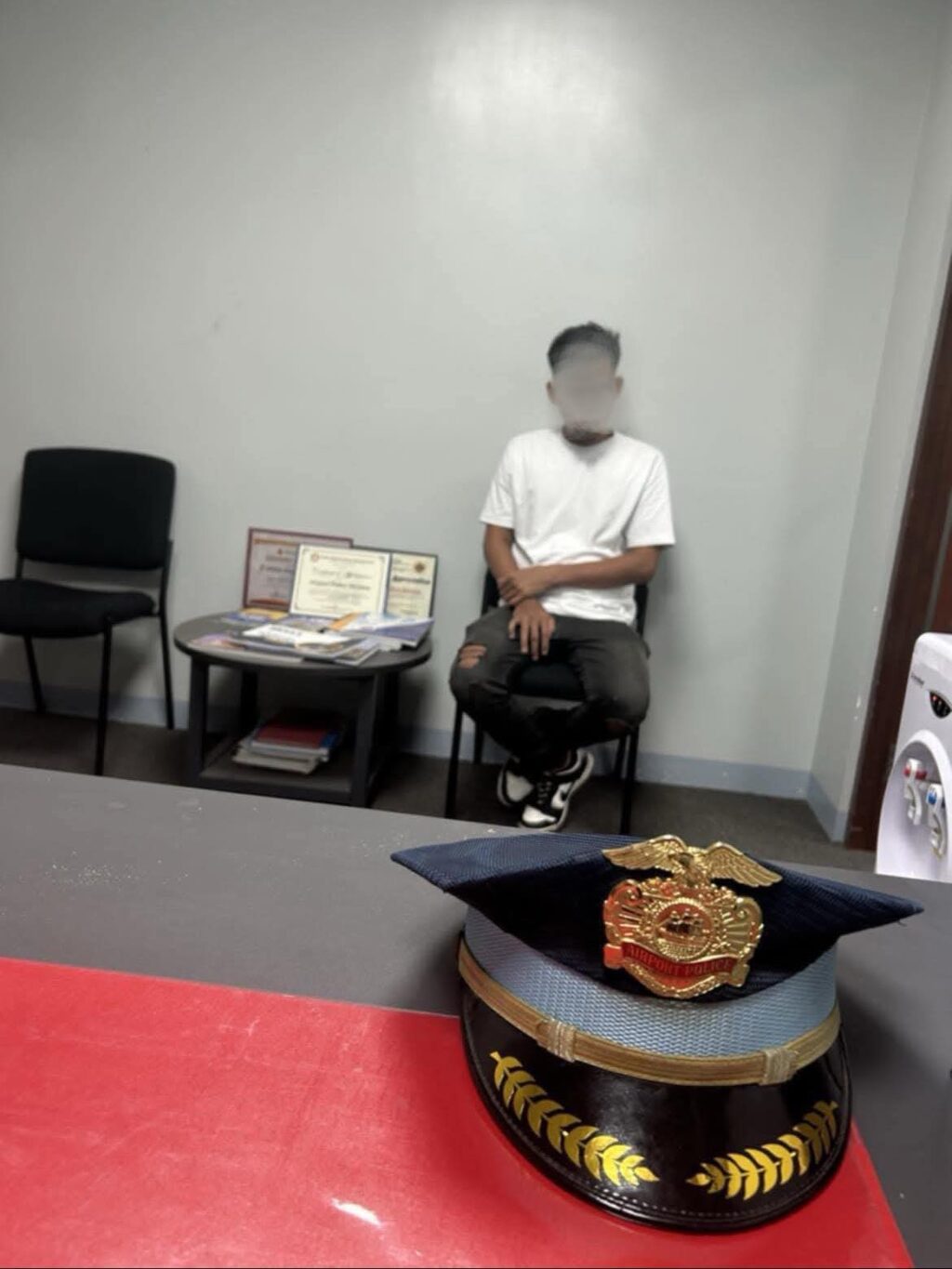 The taxicab driver who contracted passengers and asked for a higher fare was arrested by Mactan airport security personnel. | Contributed photo via Futch Anthony Inso