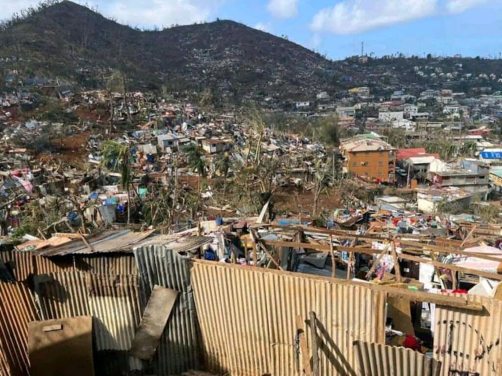 This photograph shows destroyed building after the cyclone Chido hit France's Indian Ocean territory of Mayotte, on December 14, 2024 in the capital Mamoudzou. | Photo by Daniel MOUHAMADI / AFP