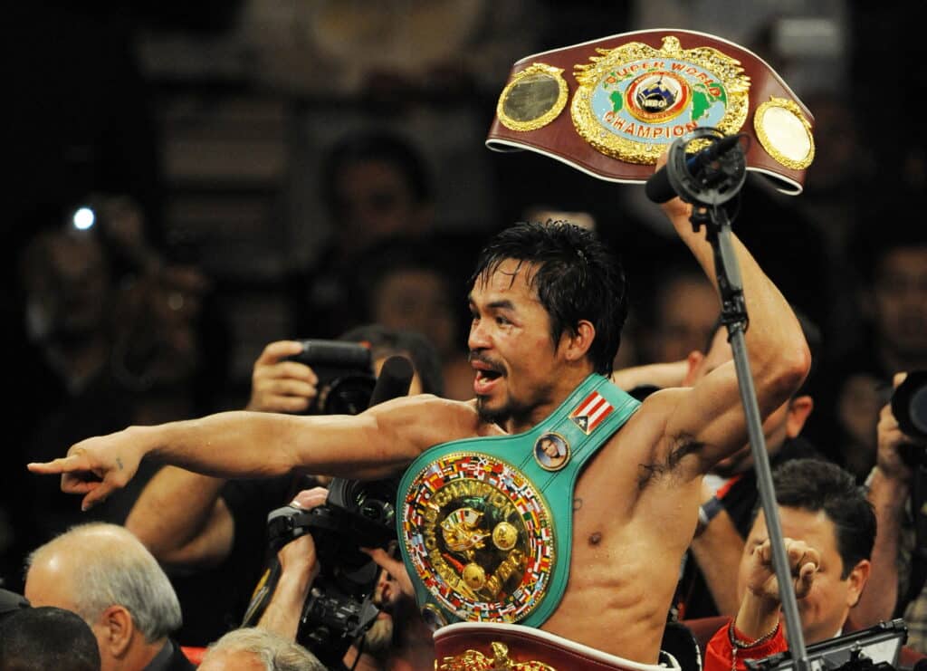 Pacquiao, 8-division champion, elected to Boxing Hall of Fame. In photo is Manny Pacquiao of the Philippines celebrating after defeating Miguel Angel Cotto of Puerto Rico in their WBO Welterweight Championship fight at the MGM Grand Garden Arena on November 14, 2009 in Las Vegas, Nevada. With this victory, Pacquiao won his seventh world title in as many divisions. [FILE PHOTO] AFP PHOTO/Mark RALSTON