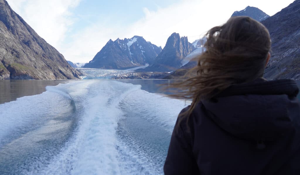 Trump calls to buy Greenland after eyeing Canada, Panama Canal. In photo is a woman looking out from a toour boat as it sails from a glacier in the west coast of Greenland. | AFP