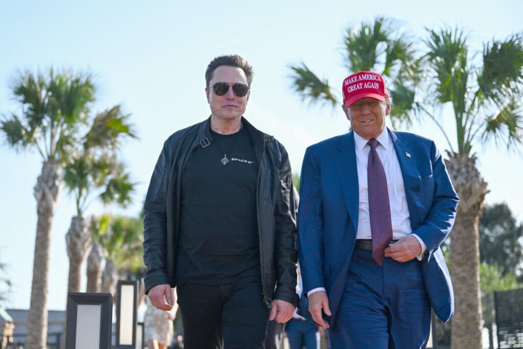 U.S. President-elect Donald Trump greets Elon Musk as he arrives to attend a viewing of the launch of the sixth test flight of the SpaceX Starship rocket on November 19, 2024 in Brownsville, Texas. SpaceXs billionaire owner, Elon Musk, a Trump confidante, has been tapped to lead the new Department of Government Efficiency alongside former presidential candidate Vivek Ramaswamy. | Brandon Bell/Getty Images/AFP