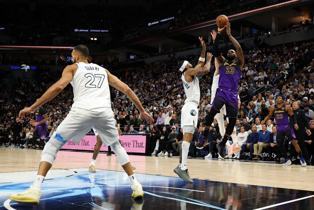 LeBron James #23 of the Los Angeles Lakers shoots the ball against Nickeil Alexander-Walker #9 of the Minnesota Timberwolves in the fourth quarter at Target Center on December 02, 2024 in Minneapolis, Minnesota. The Timberwolves defeated the Lakers 109-80. Photo by David Berding/Getty Images via AFP