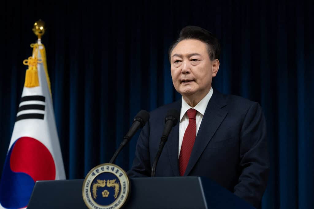 South Korean president banned from leaving country. This handout photo taken and released on December 7, 2024 by the South Korean Presidential Office shows South Korea's President Yoon Suk Yeol delivering an address at the Presidential Office in Seoul. | Photo by Handout / South Korean Presidential Office / AFP